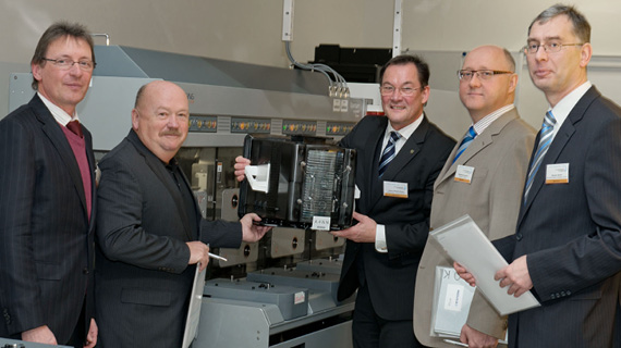 Group of people with suits at an installation