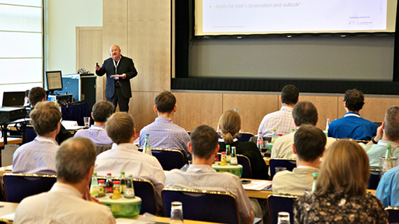 Conference environment with audience and speaker on podium