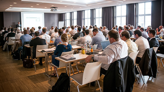 Many people in a conference from behind